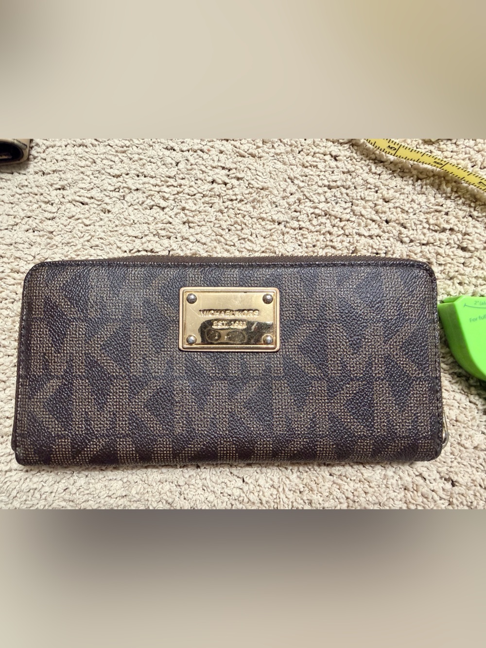Michael Kors Dark Brown Monogram Zip Around Wallet with Gold Plaque